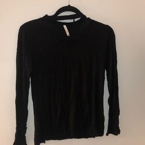 Black long sleeve shirt with cutout